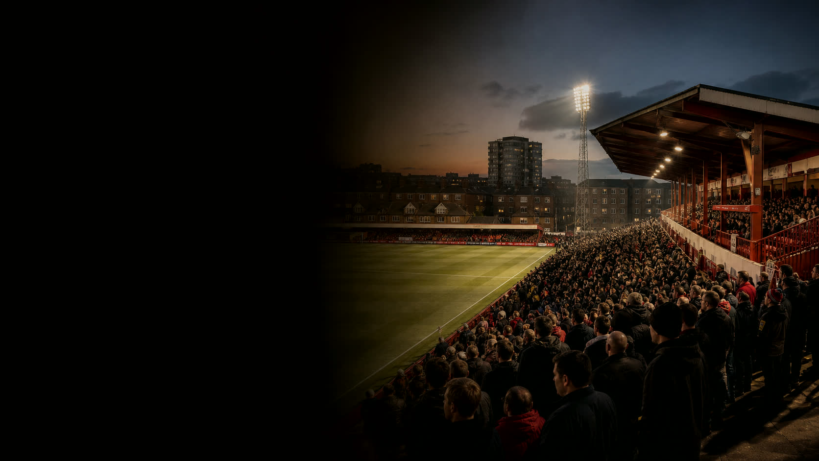 Brisbane Road at dusk — a full house under the floodlights