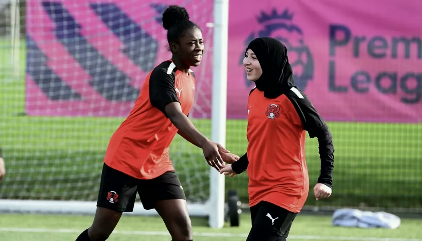 Girls playing football with Leyton Orient in the community